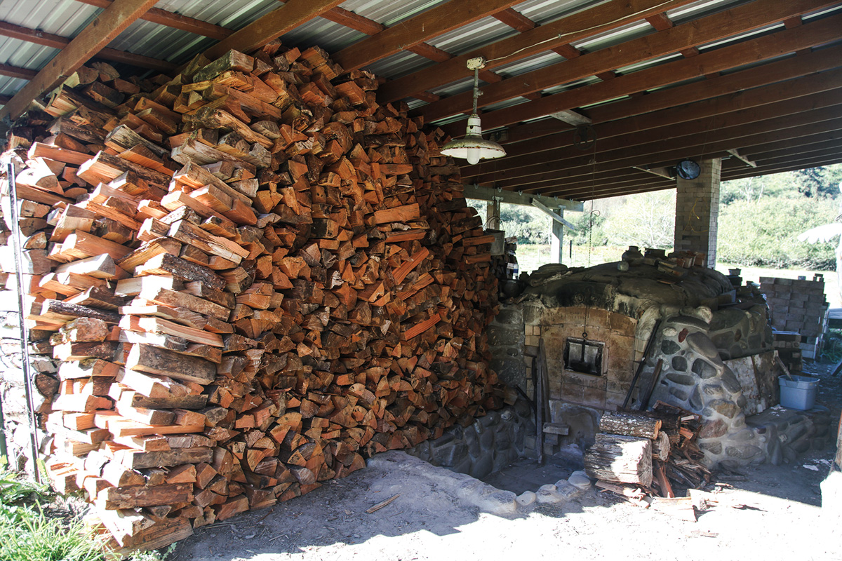 wood is stacked ready to fuel the fire in a kiln