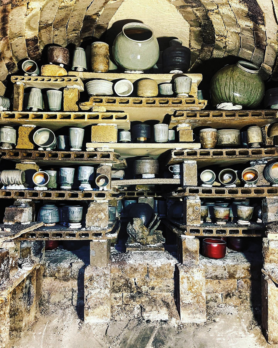 ceramics stacked on multiple shelves