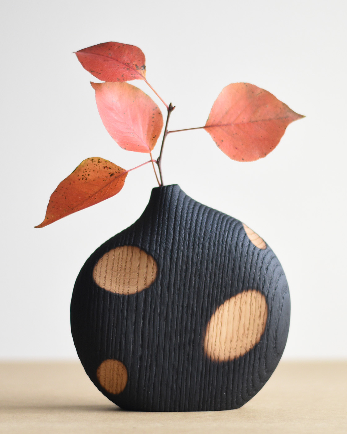 wood vase with orange leaves